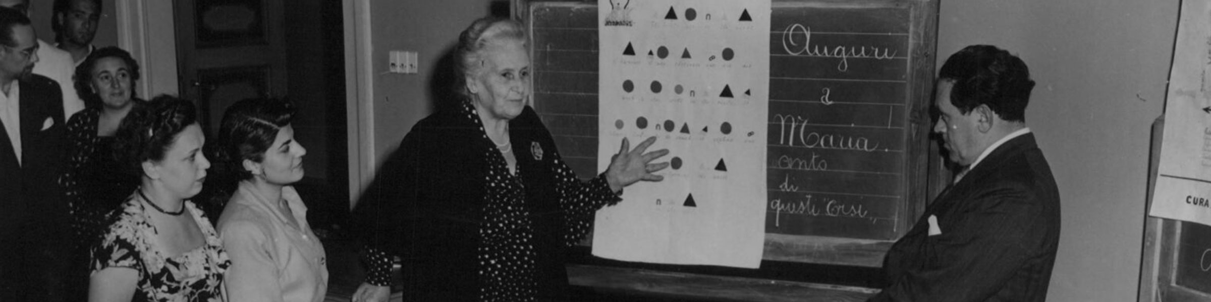 Maria and Mario Montessori discussing grammar symbols at the 1950 Perugia training course
