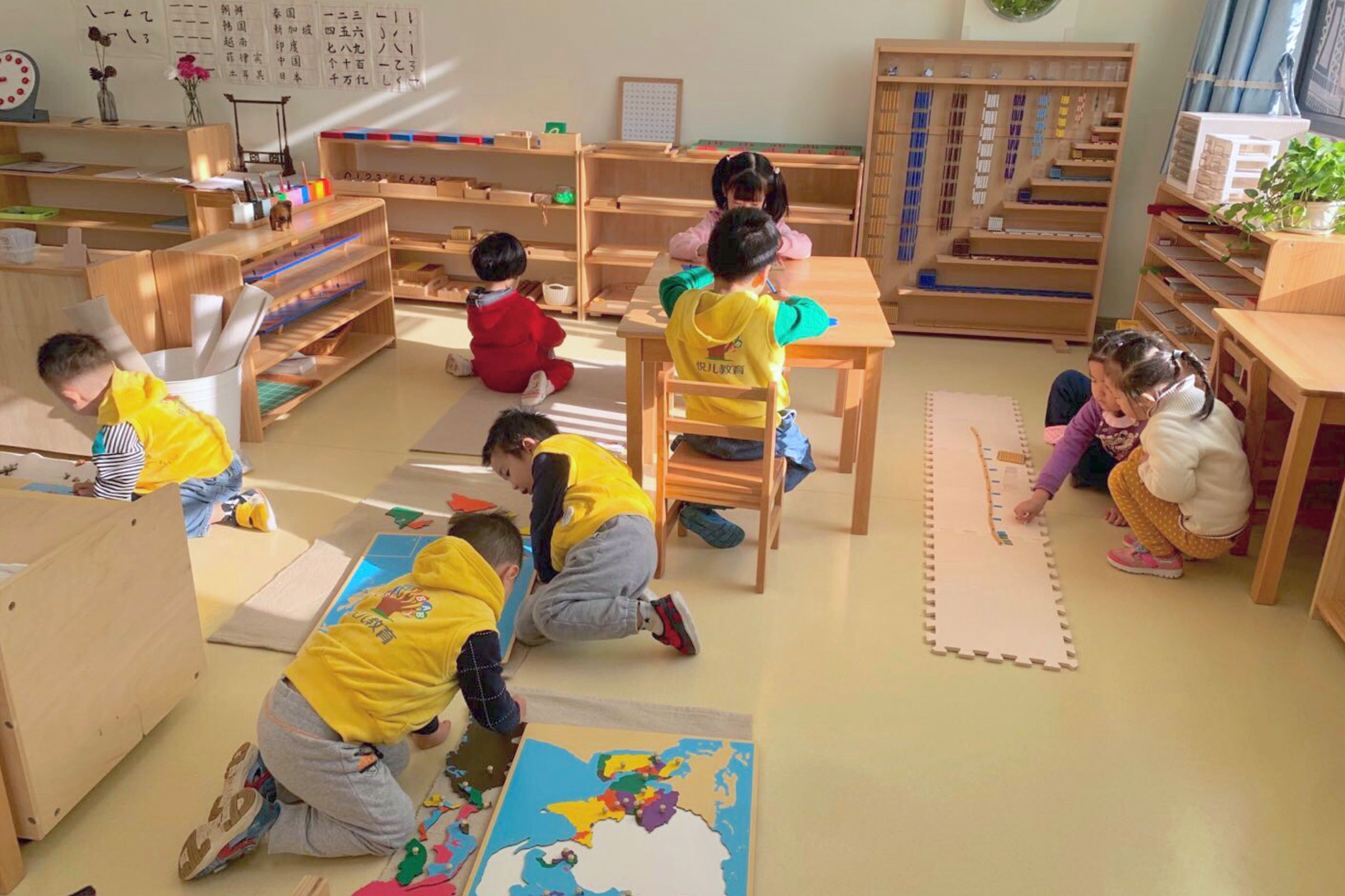 Children working in a Montessori classroom