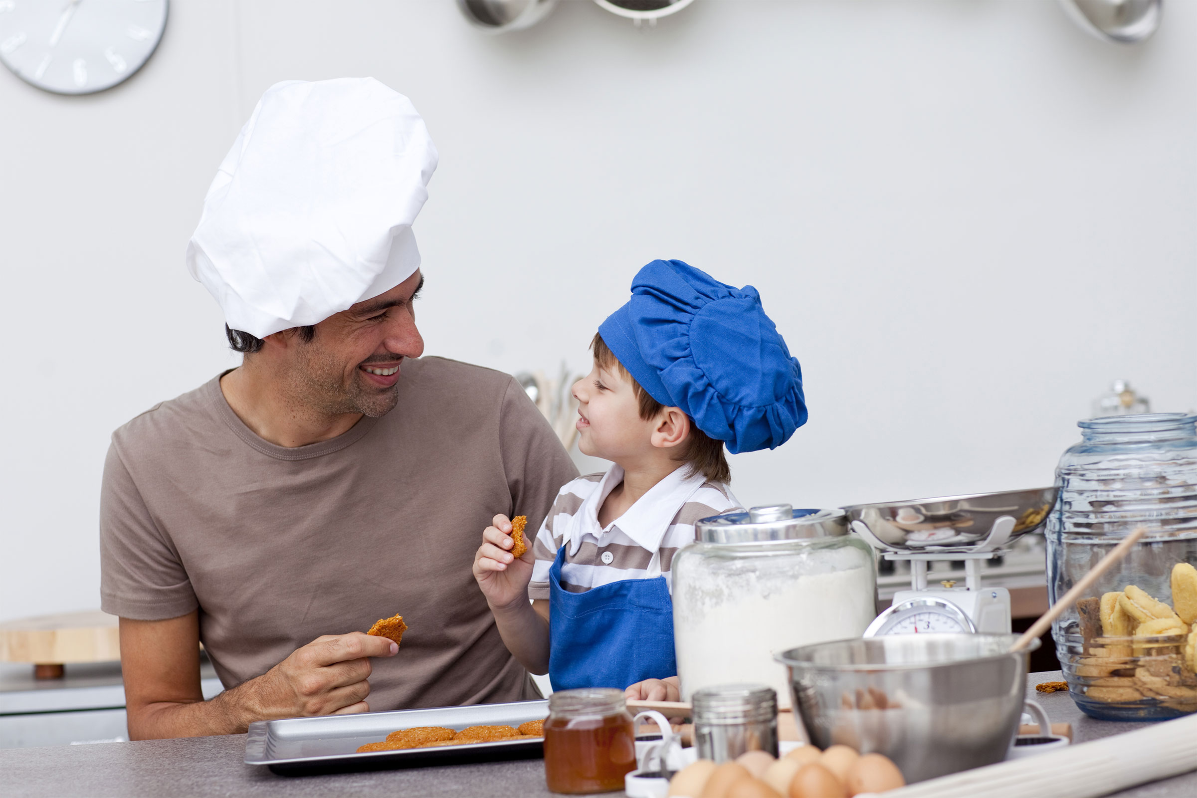 Parent and child cooking together